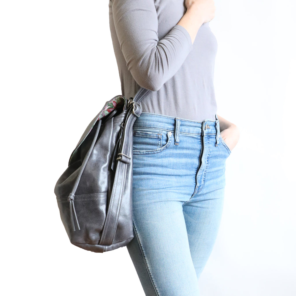 Side-front view of model wearing 1904 large crossbody. 