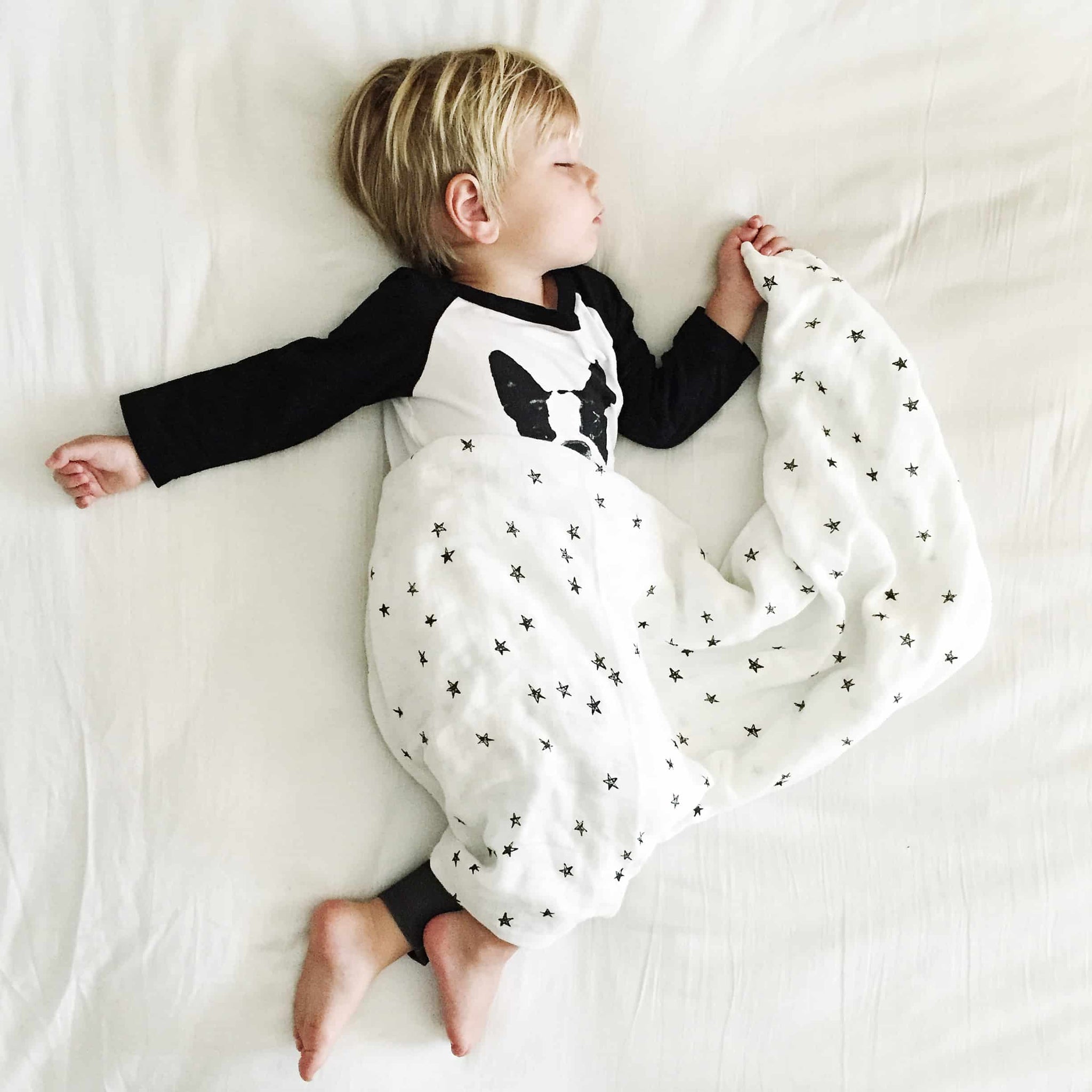 organic muslin swaddle stars boy sleeping