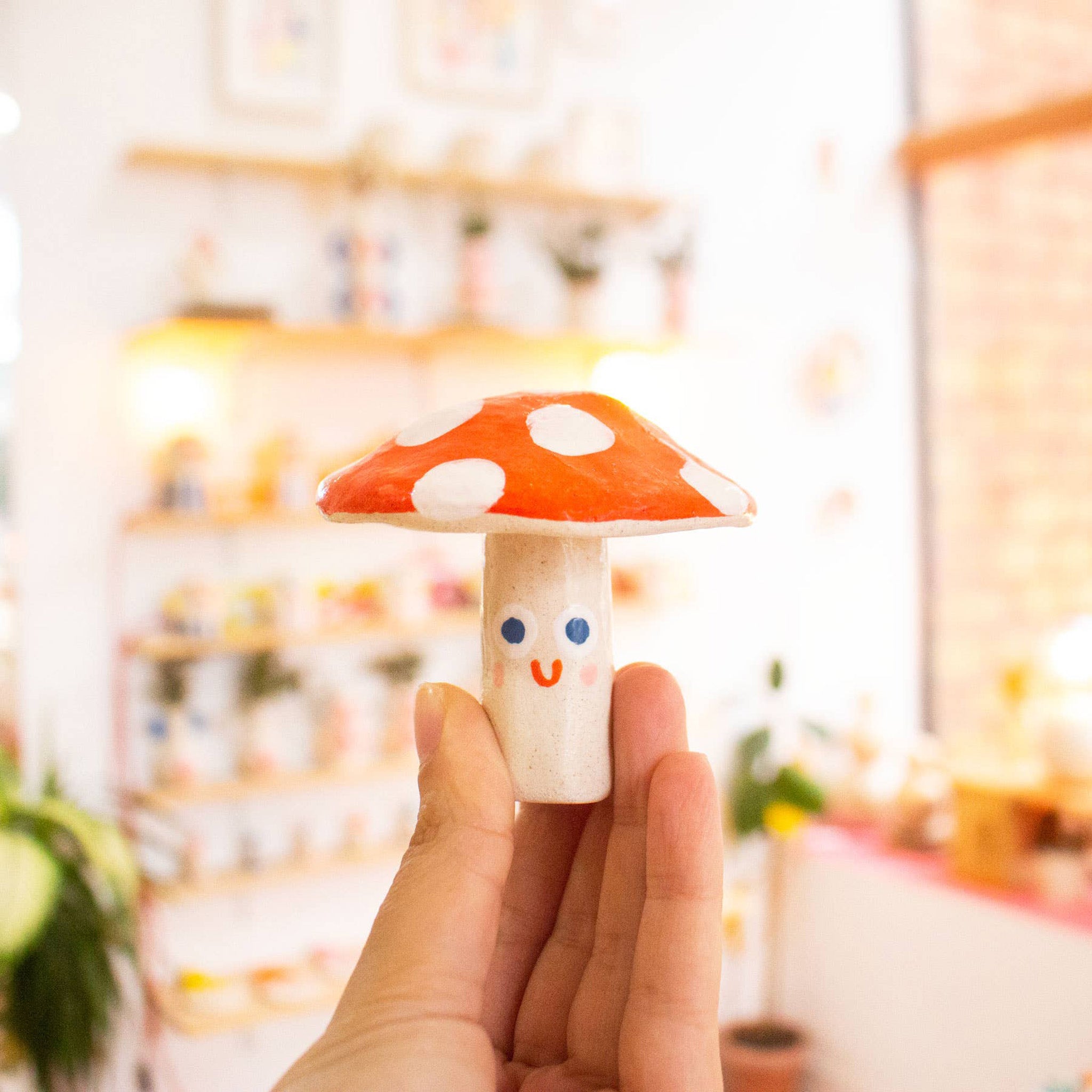 ceramic mini mushroom in hand