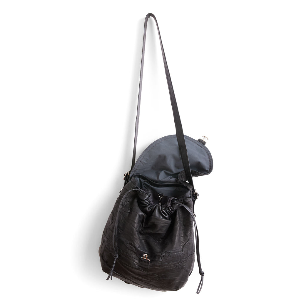 1904 medium in milano black and black with nickel hardware front view open flap, flap is lined in petrol textile 