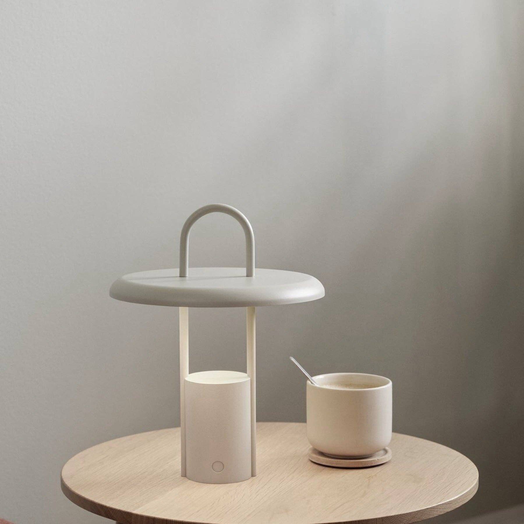 stelton led lamp  sand on table