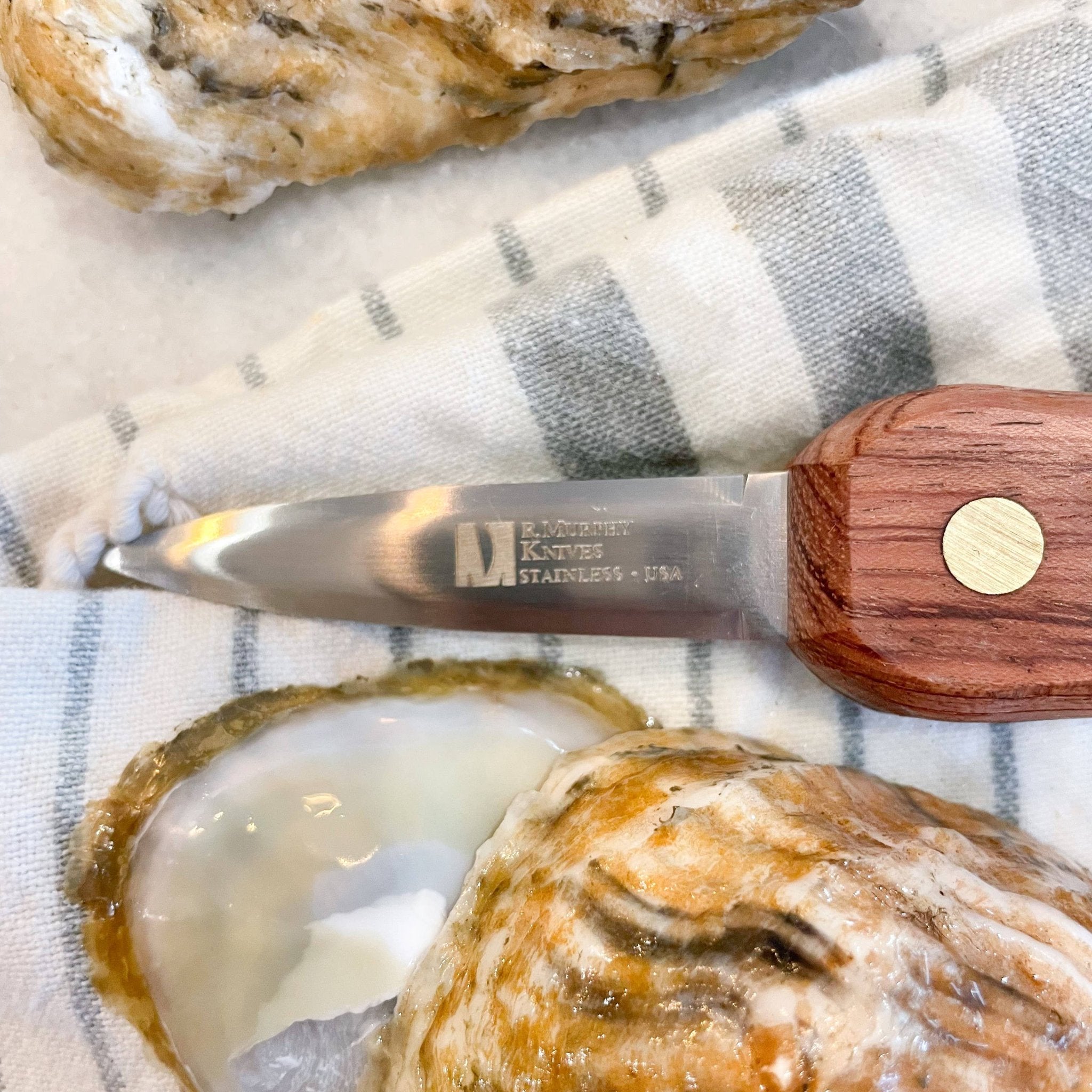 rosewood macKenzie's signature oyster shucker