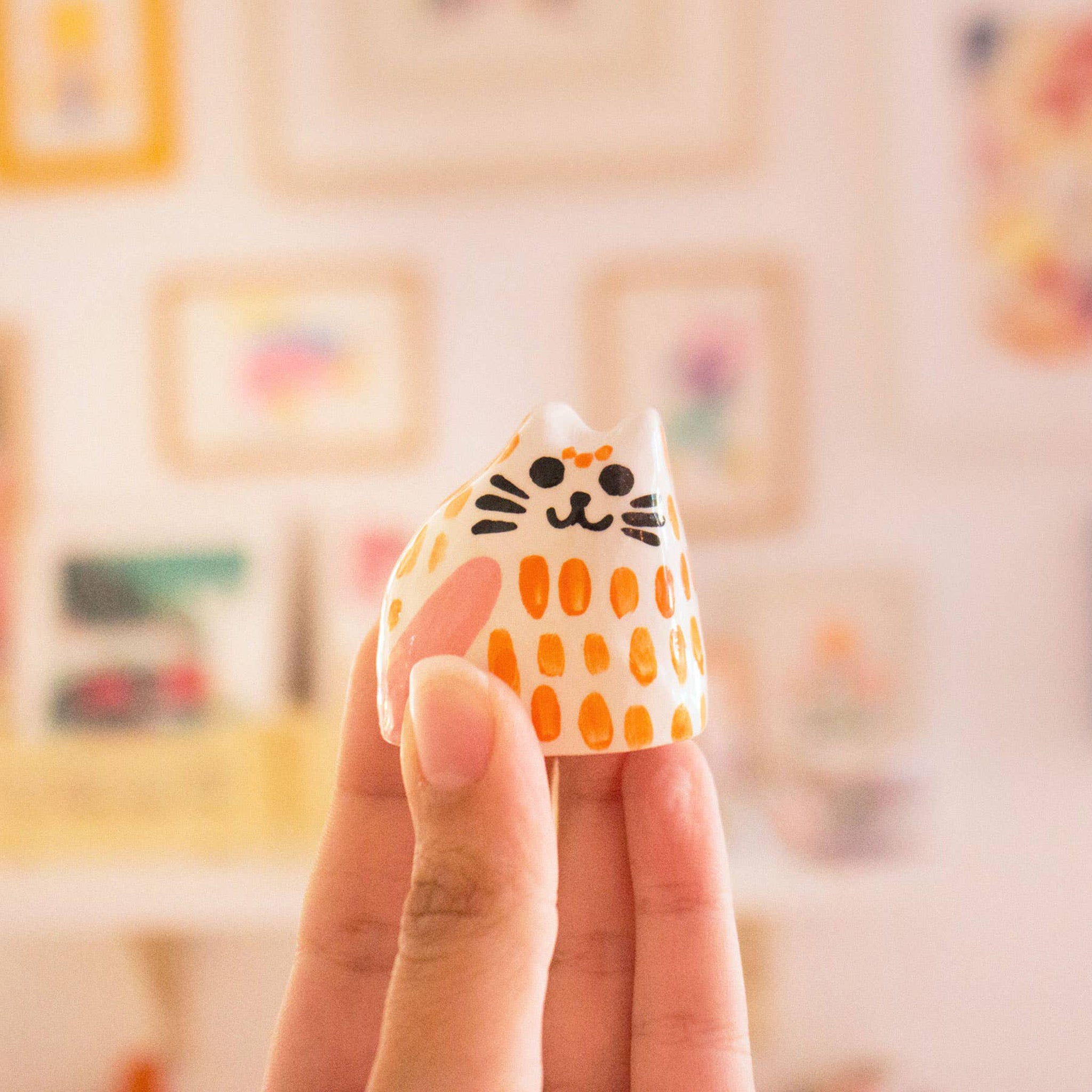 ceramic baby cat orange in hand