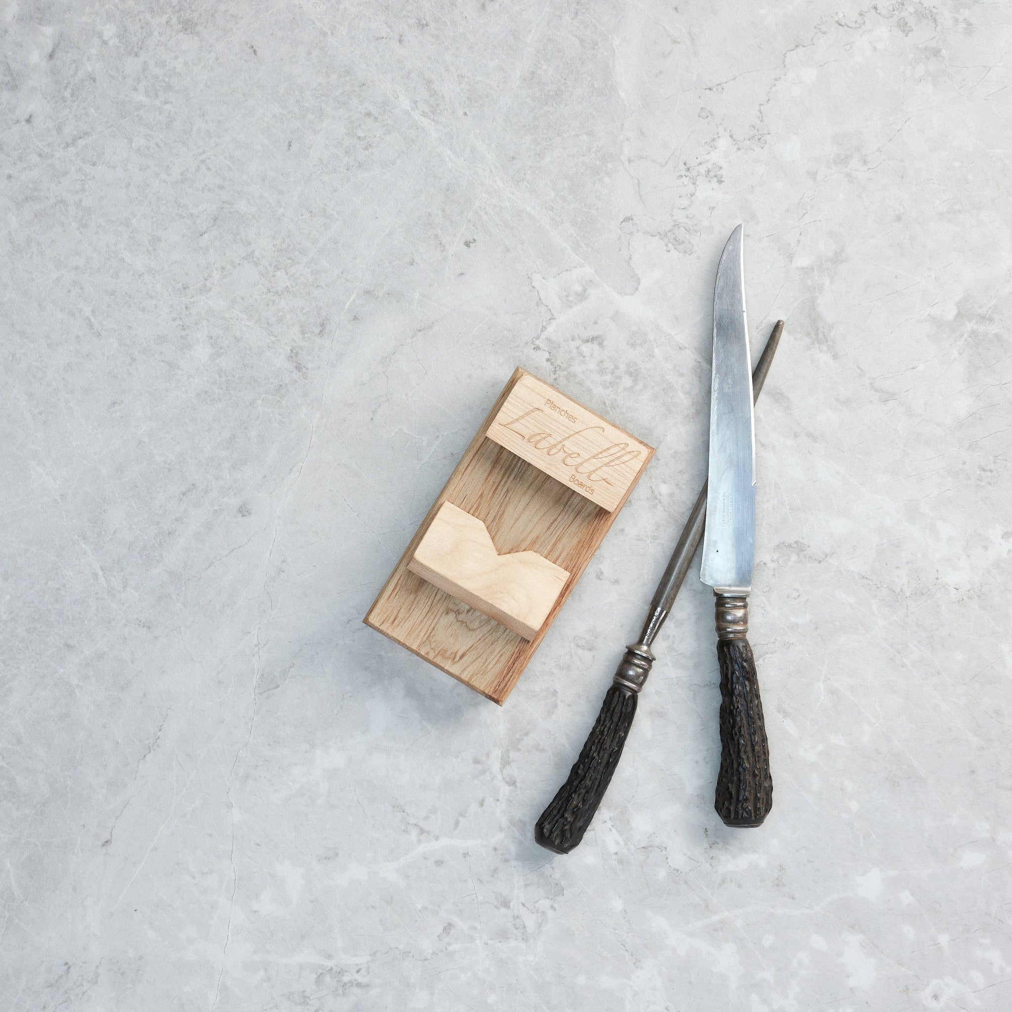 oyster shucking board made of maple hardwood besides oyster shucking tools