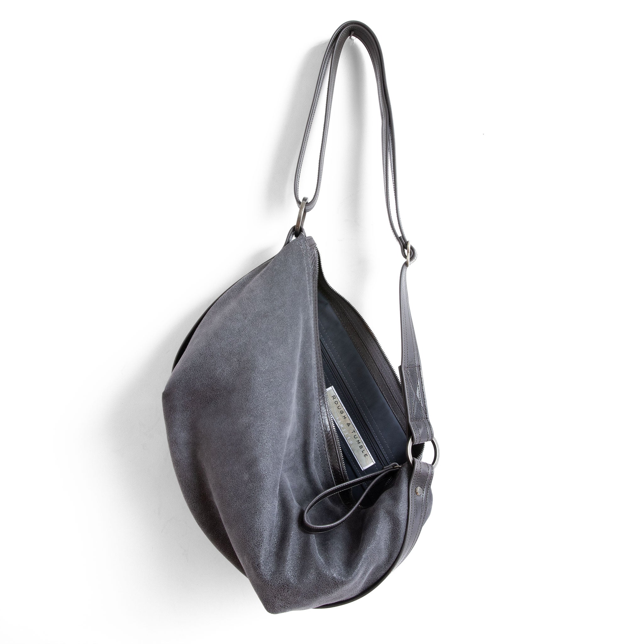 beau duffel in mineral grey, showcasing interior petrol lining and zippered pocket