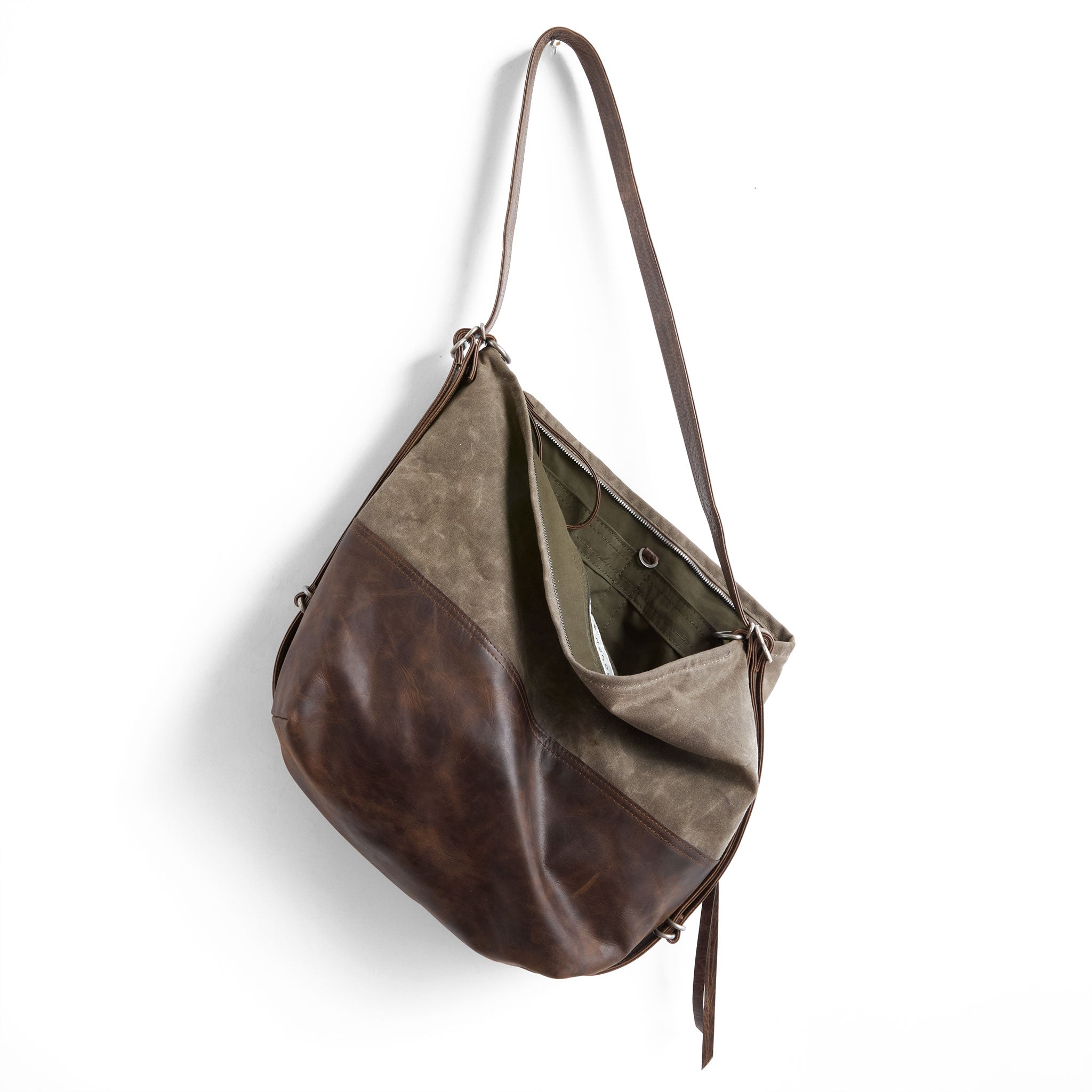 city safari size large in rustic pecan and dark oak waxed canvas, showcasing interior open pockets