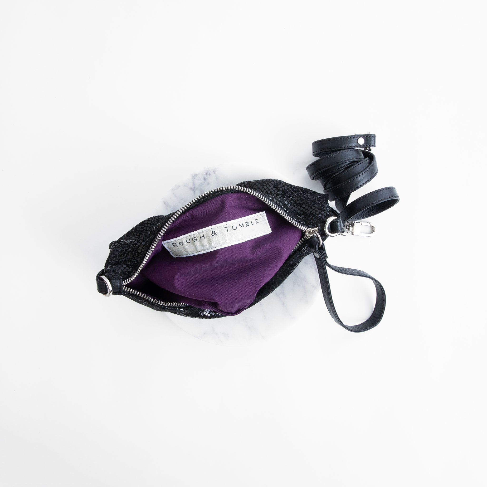 roro crossbody in gleam showcasing interior purple lining