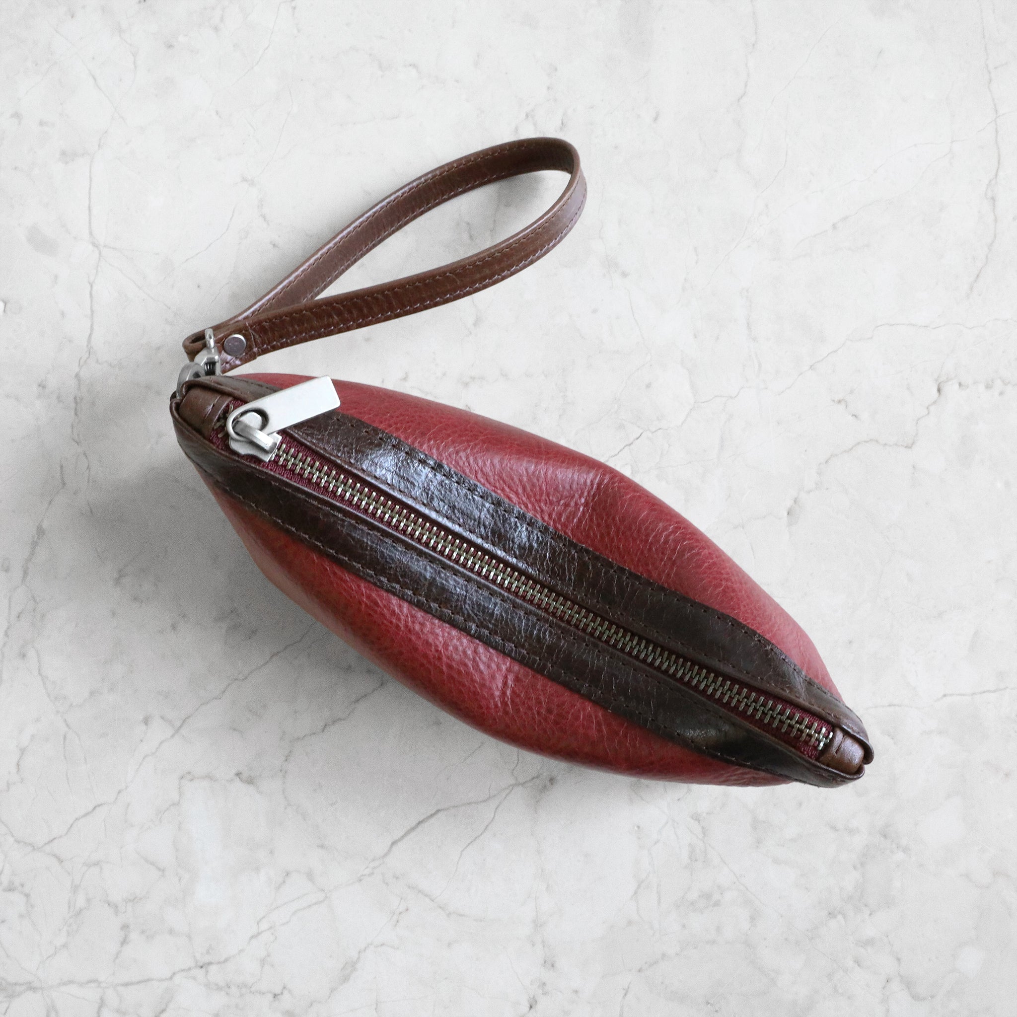 top view of zip pouch with top stripe medium in bliss and mahogany
